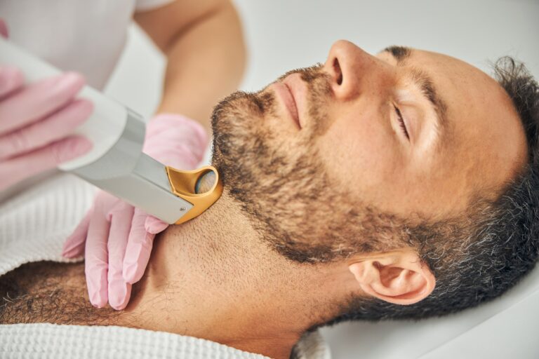 Handsome bearded man having laser hair removal procedure